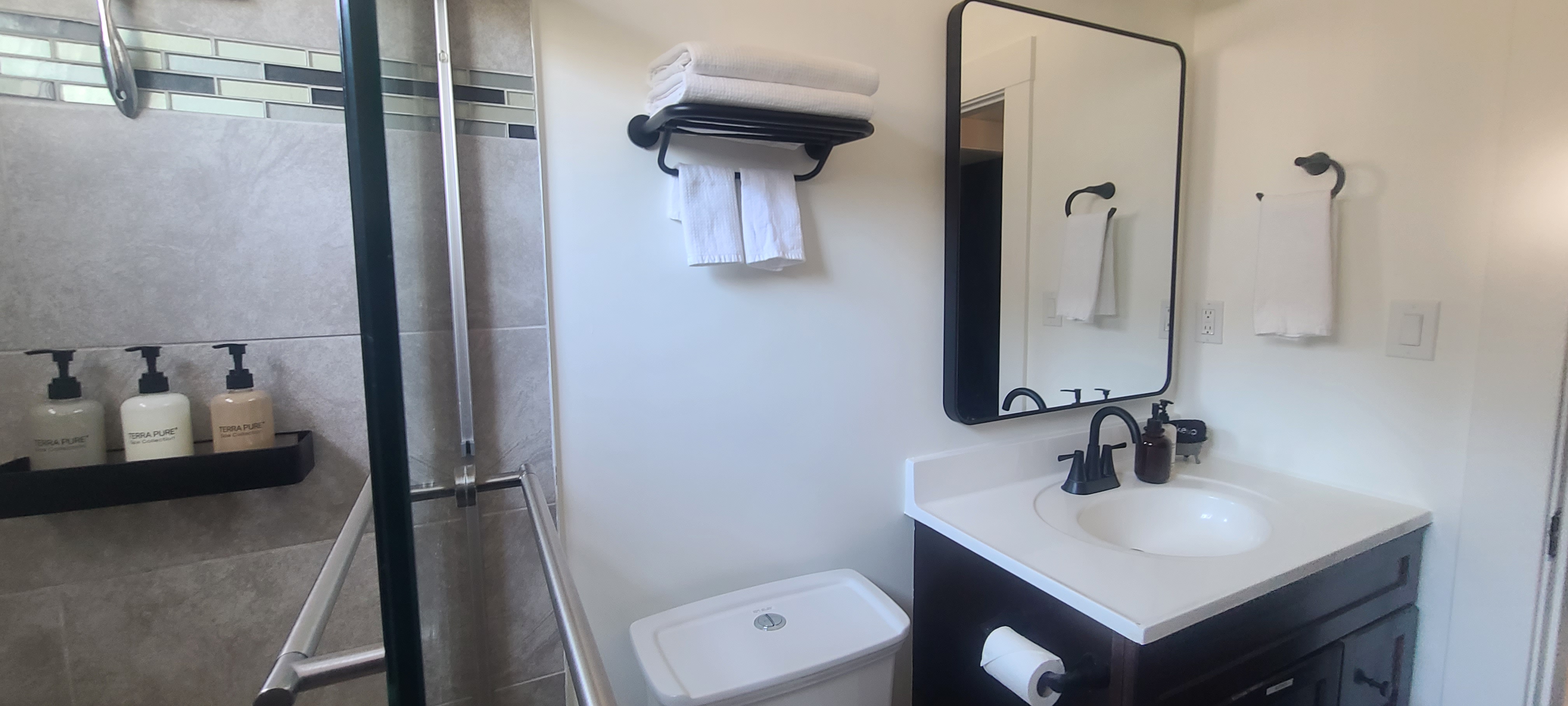 Bathroom styled with Terra Pure amenities and fresh towels